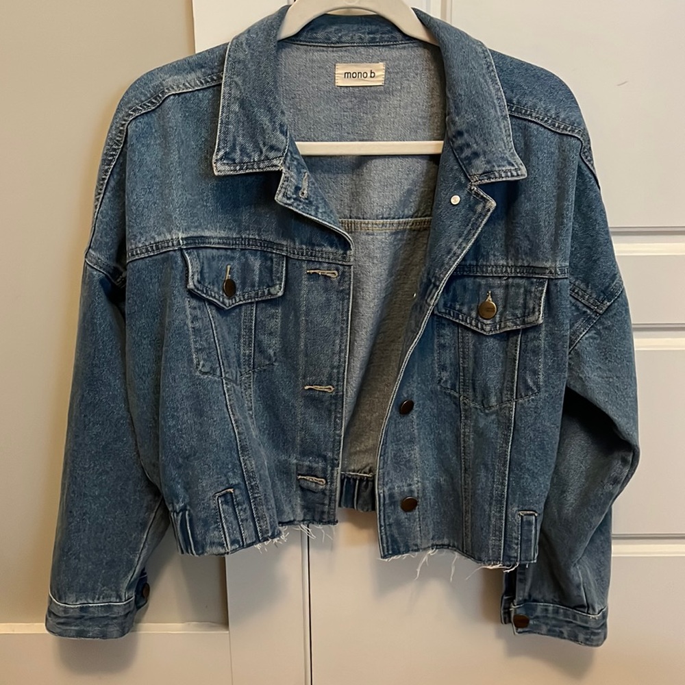 Cropped blue denim jacket with cinched back
